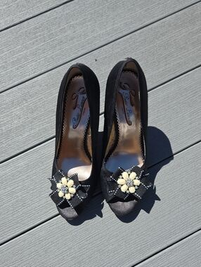 Pelle Moda Black Suede Peep-Toe Heels with Cream Floral Accent